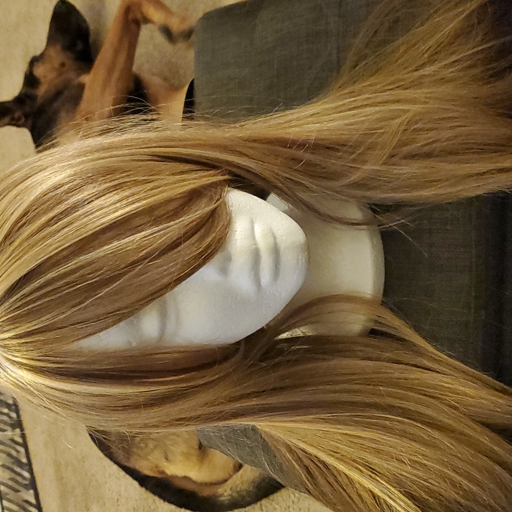 Blonde wig with bangs 24" long gently tapered.
